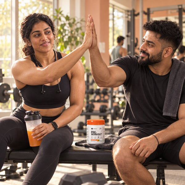 Two friends high-fiving in the gym with EVRYDAY Pre-Workout