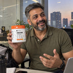 Customer holding EVRYDAY Creatine Monohydrate - Tangy Orange