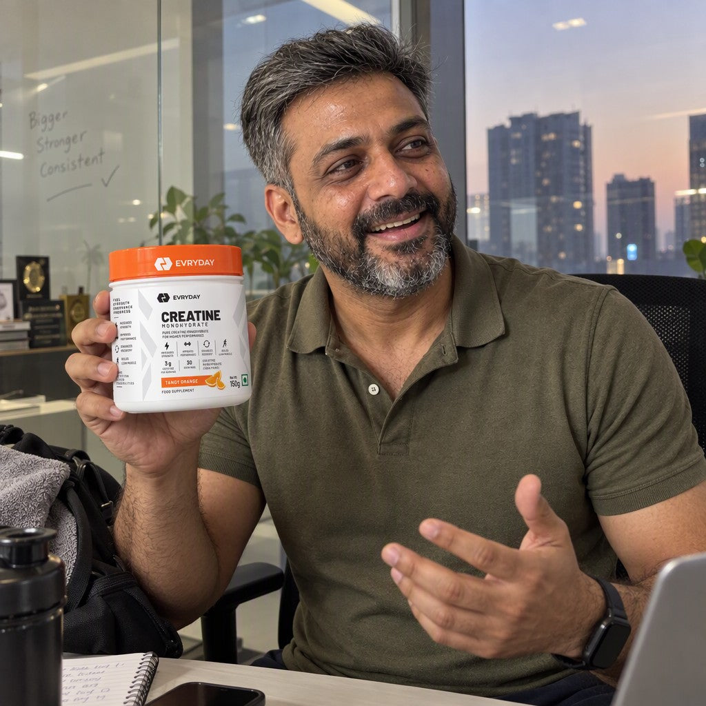 Customer holding EVRYDAY Creatine Monohydrate - Tangy Orange
